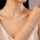 necklace with white freshwater pearls and pink gold stainless steel beads
