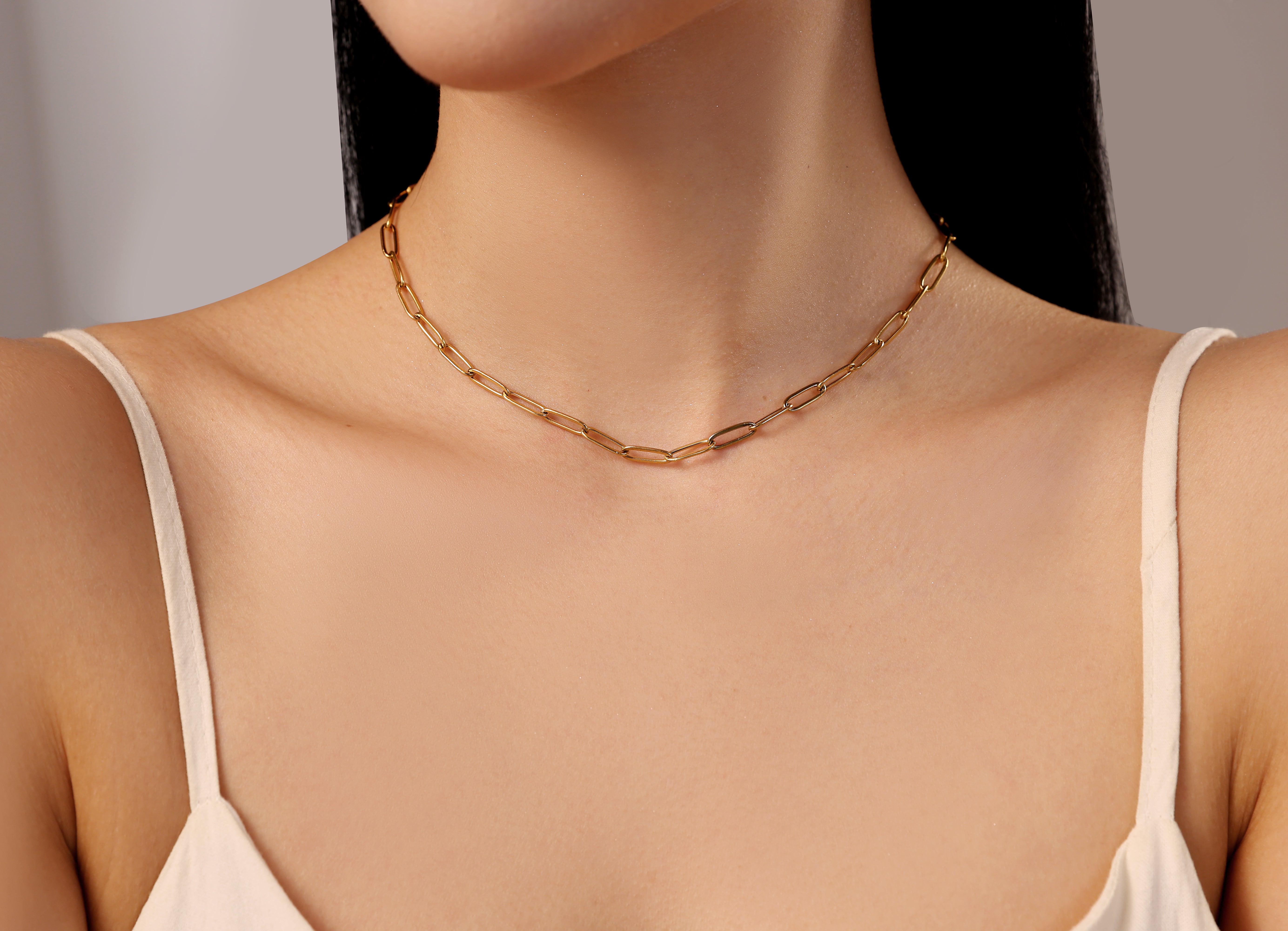 model wearing gold waterproof stainless steel link necklace