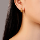 model wearing gold Lucia stainless steel waterproof chunky small hoop earrings