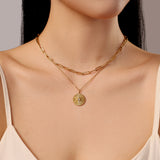 Model Wearing Gold Necklace Layering Set Made From Waterproof Stainless Steel Link Chain Sunburst Pendant