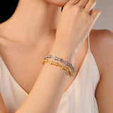 model wearing silver gold waterproof stainless steel barbed wire bangle