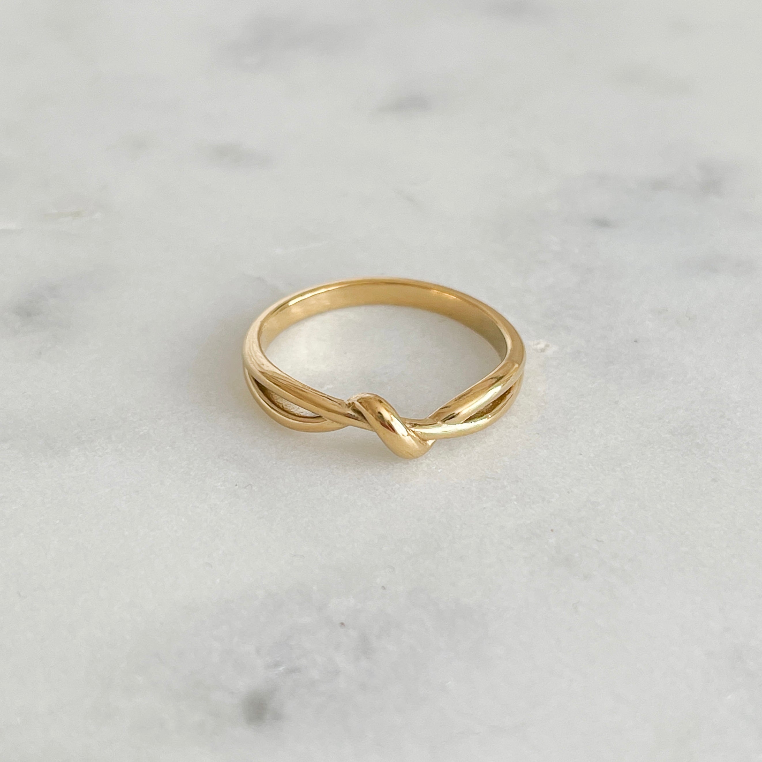 Product photo of gold ring with knot detail 