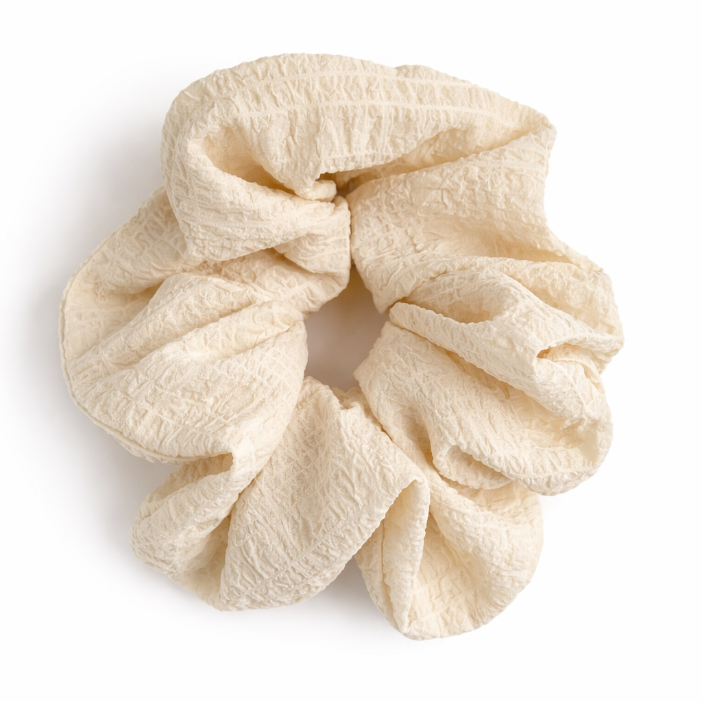 Beige scrunchie on a white background