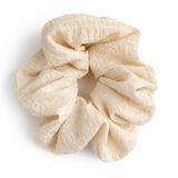Beige scrunchie on a white background