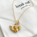 Gold fine chain with gold cherub charm and small lilac coloured gem charm 