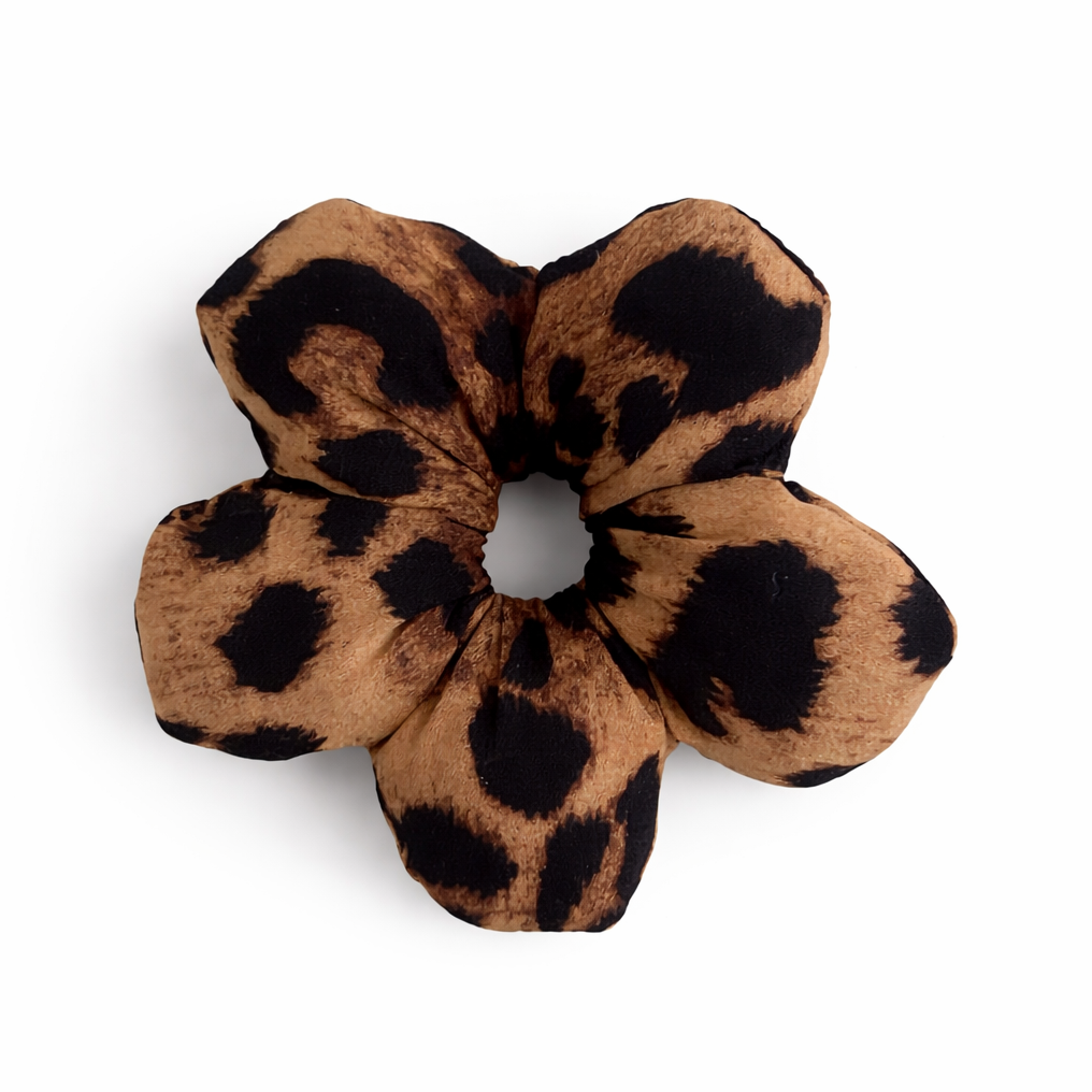 Small Leopard print flower shaped scrunchie on a white background