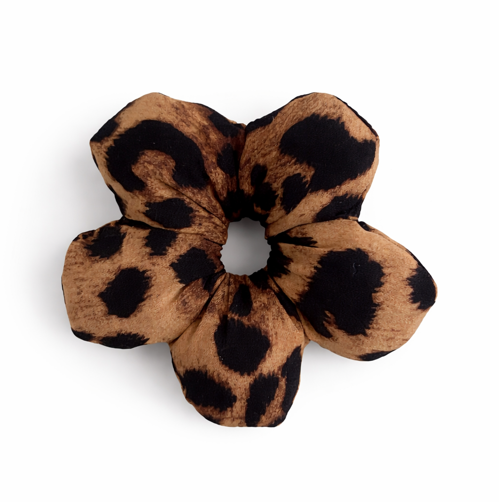 Small Leopard print flower shaped scrunchie on a white background